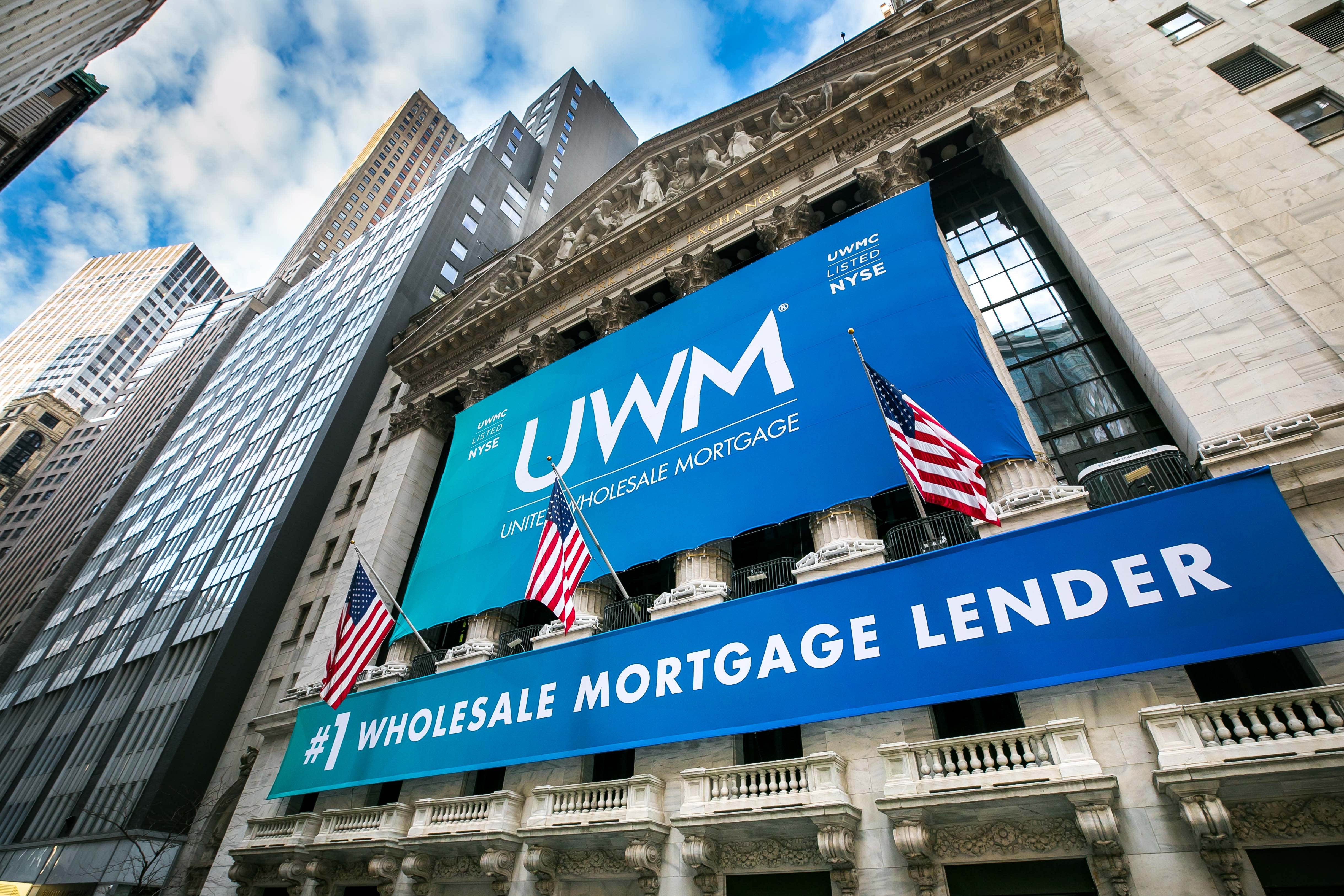 UWM Wholesale Mortgage Lender banners displayed on a New York City building facade.
