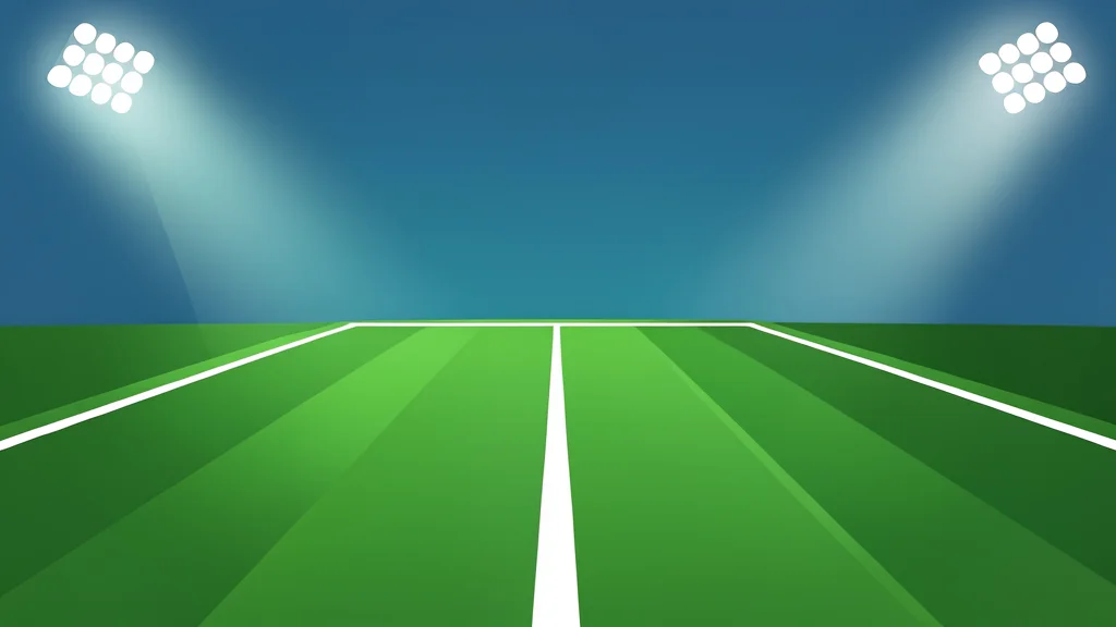 A green football field with white yard lines stretching into the distance under stadium lights