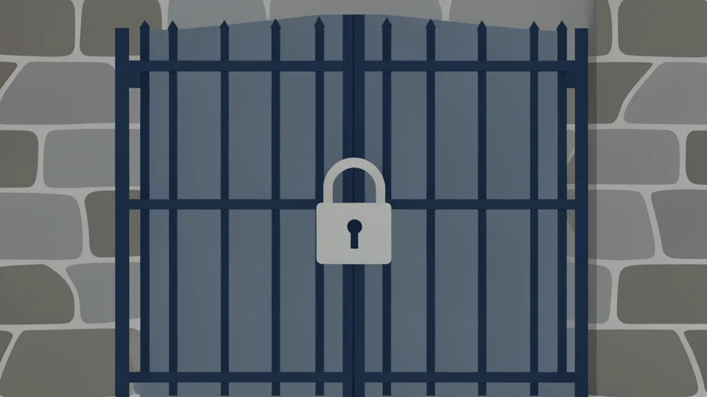 A heavy iron gate with a padlock set against a stone wall