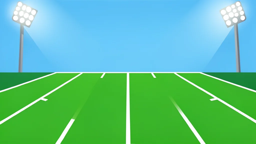 A green football field with white yard lines stretching into the distance under stadium lights