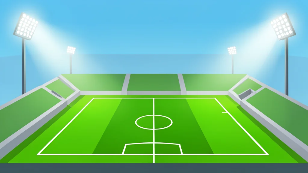 A large, empty football stadium with green grass and white boundary lines under bright floodlights