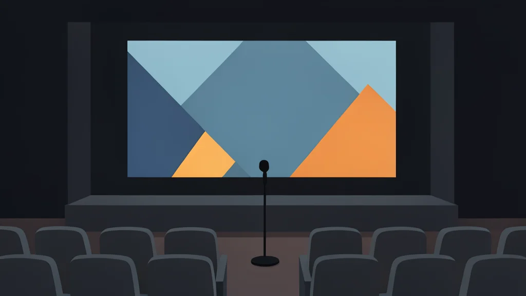 A dimly lit stage with a large projection screen displaying abstract geometric shapes, surrounded by rows of empty audience seats and a single microphone stand in the foreground.