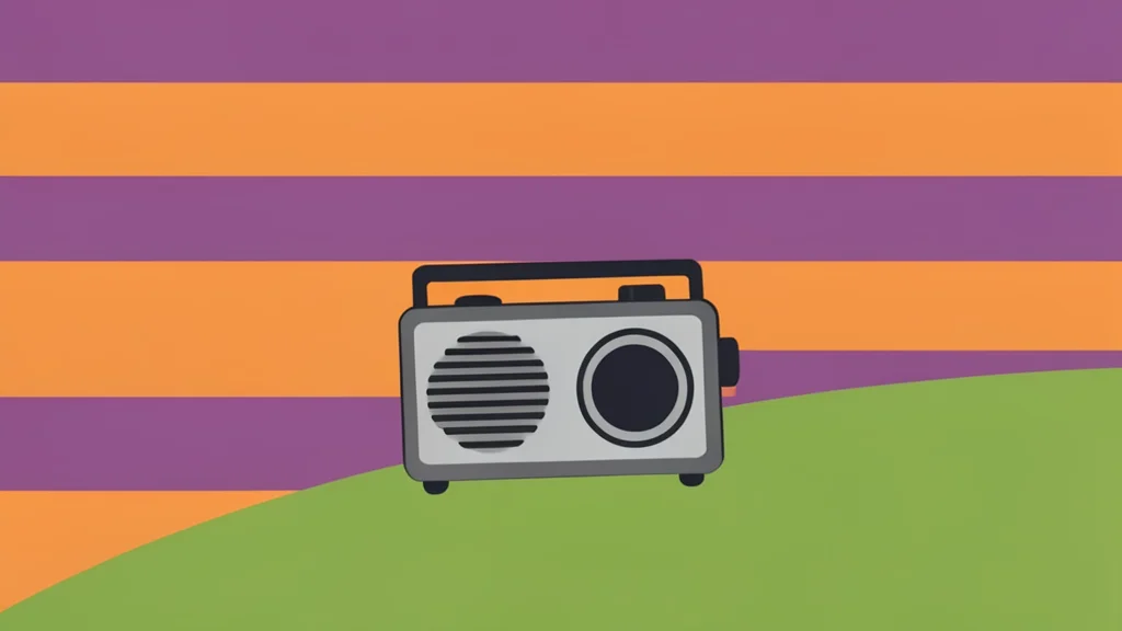 A small, portable radio device resting on a grassy hillside at sunset