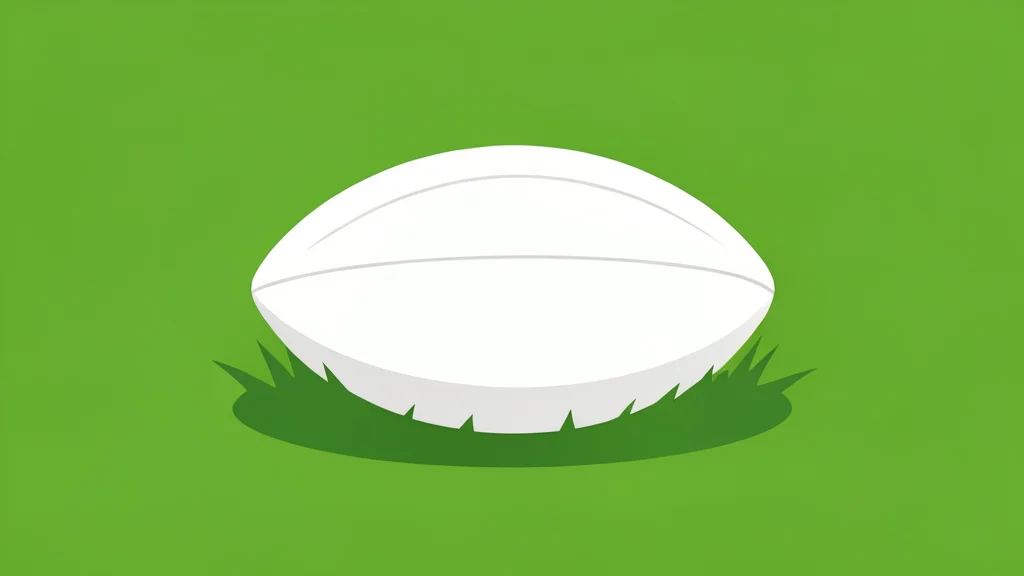 A single white football resting on green grass
