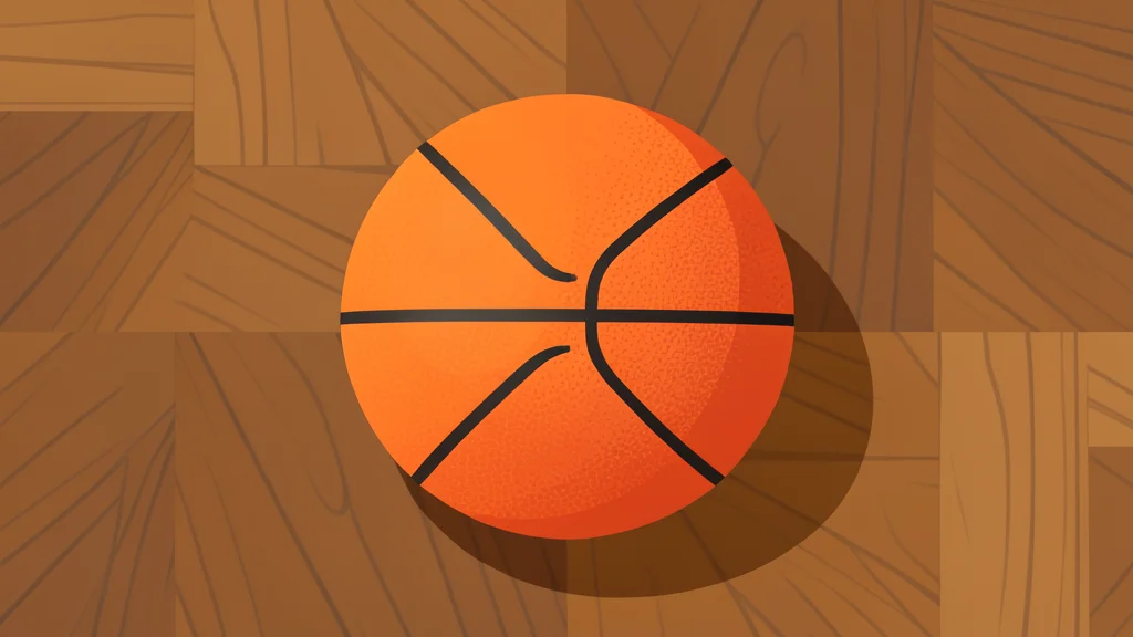 A polished basketball resting on a wooden court floor