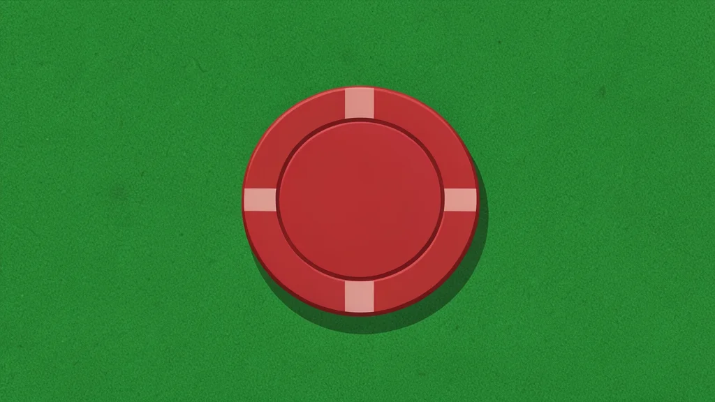 A single red poker chip resting on a green felt table surface