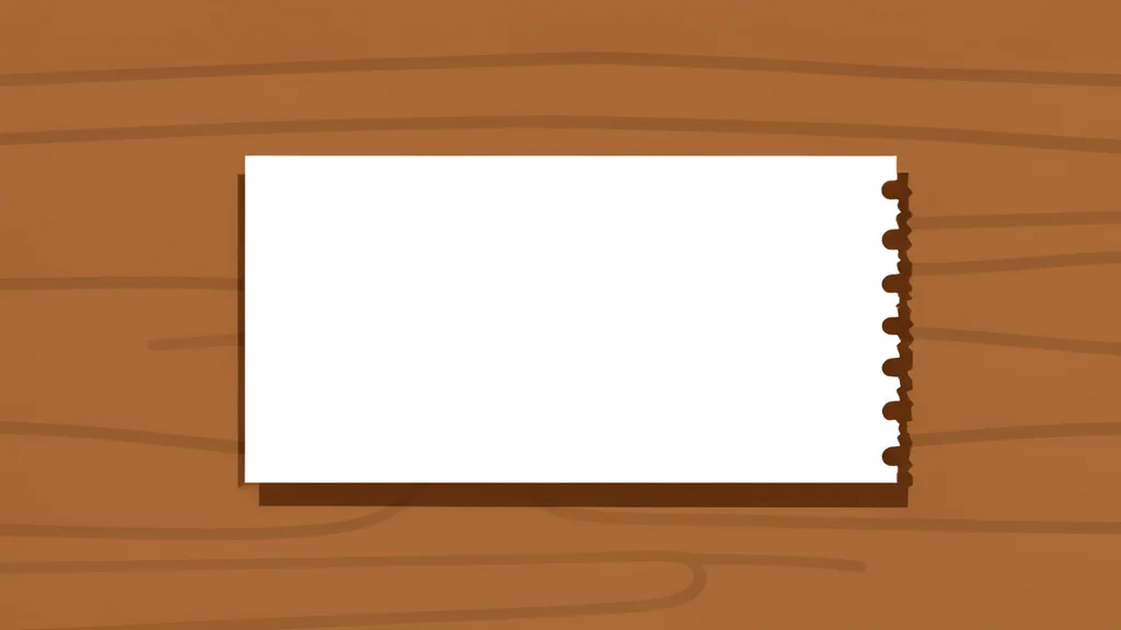 A single white paper ticket with a perforated edge resting on a wooden surface