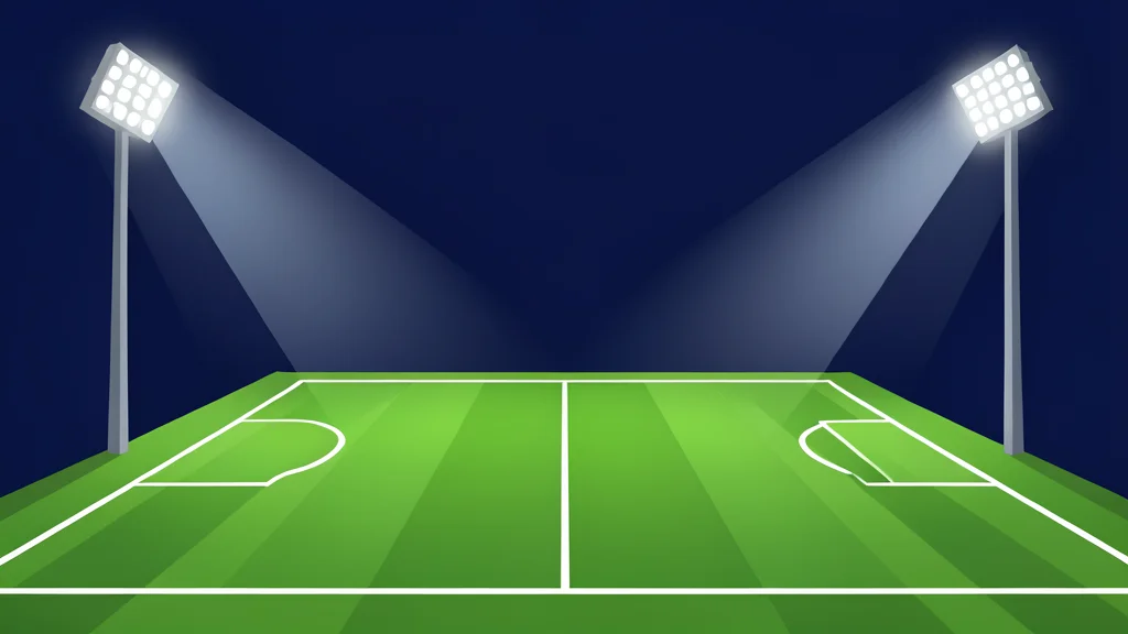 A green football pitch with white boundary lines under stadium floodlights