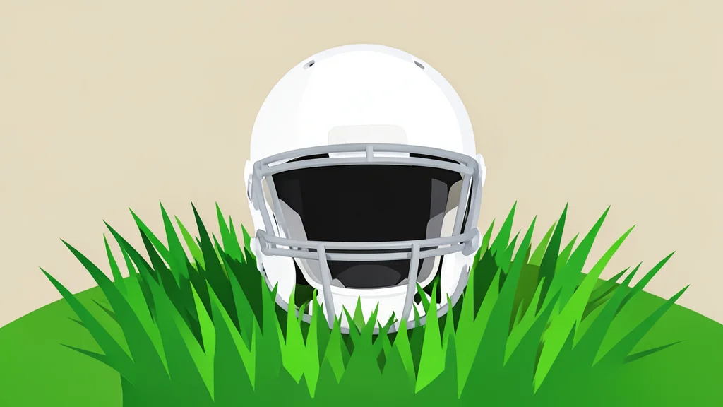 A white football helmet resting on green grass