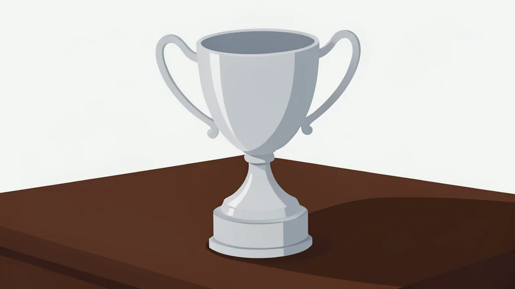 A polished silver trophy cup resting on a dark wooden table