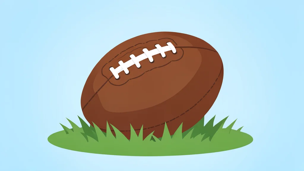 A single football helmet resting on a green grass field