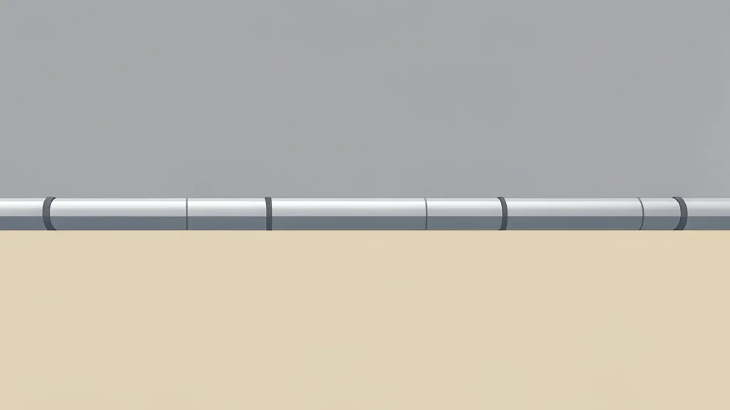 A long pipeline stretching across a vast, flat landscape under a grey sky