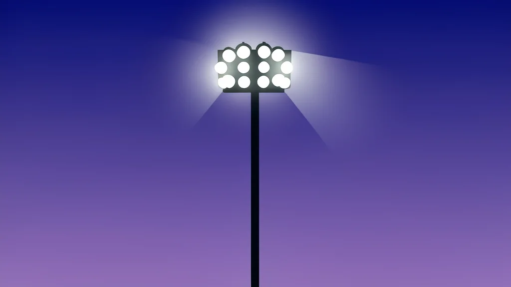 A tall stadium floodlight tower stands against a purple twilight sky