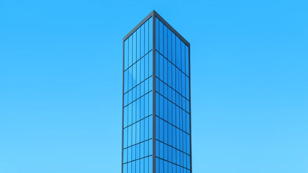 A modern glass skyscraper reflecting a clear blue sky