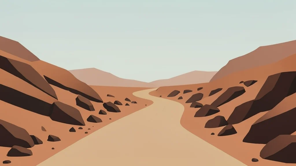 A dusty, unpaved road winding through arid, rocky terrain under a hazy sky.