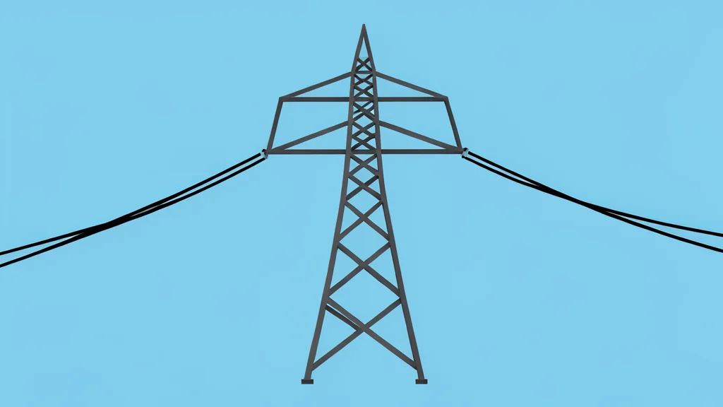 A high-voltage transmission tower standing against a clear blue sky