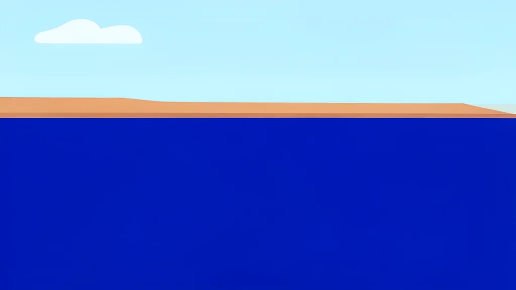 A wide expanse of deep blue sea with a narrow strip of arid land in the distance.