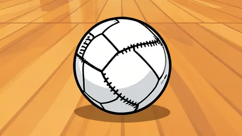 A handball resting on a polished wooden gymnasium floor