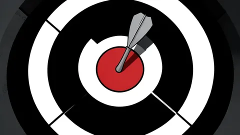 A single dart with a red flight resting on a textured wooden surface