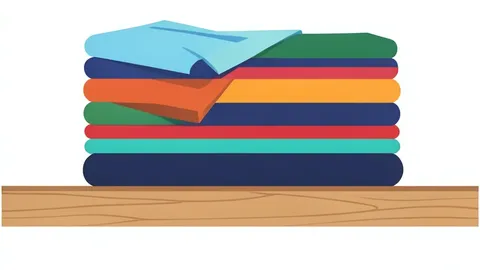 A neatly folded stack of colorful clothing items on a wooden shelf