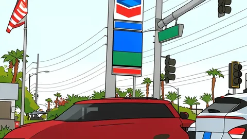 A red gas pump nozzle rests on gray concrete beside a black fuel tank.