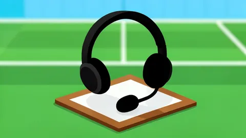 A football sideline coach's headset resting on a clipboard near a grass field