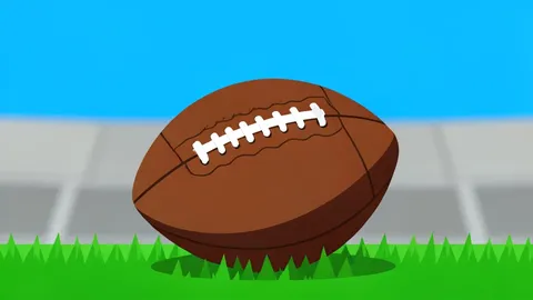 A wide-angle view of a green football field with white yard lines stretching into the distance under a clear blue sky.