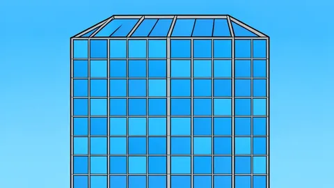 A modern glass office building with a grid of windows reflecting the sky