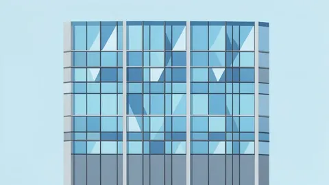 A modern glass office building facade with geometric window patterns