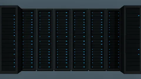 A dense array of black server racks with glowing blue status lights in a dark room