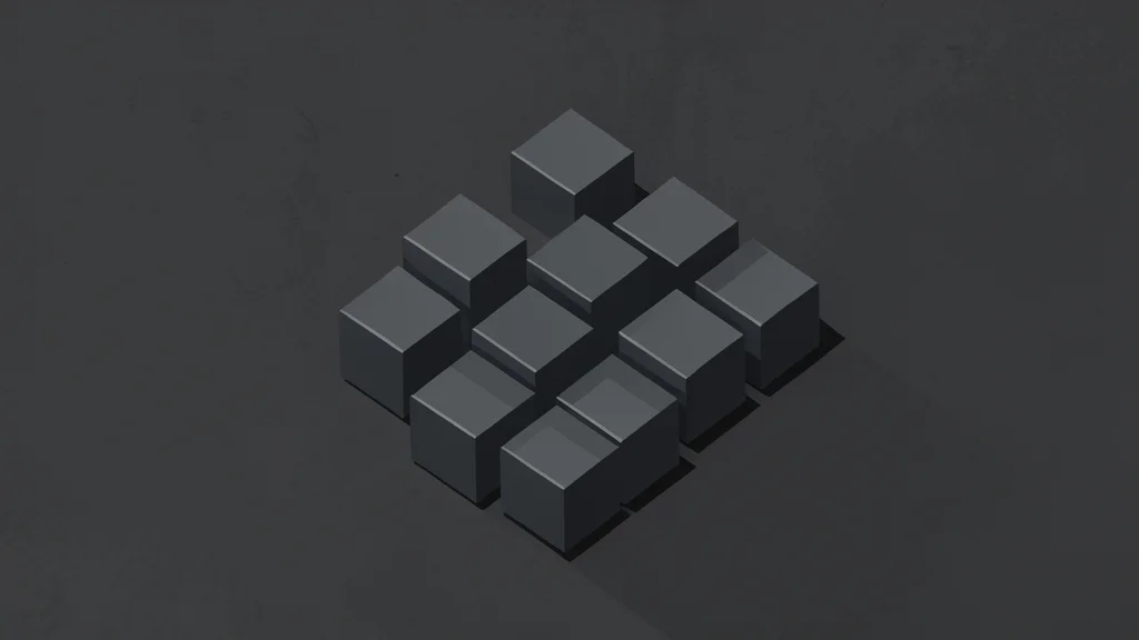 A cluster of small, dark grey metallic cubes arranged on a textured industrial surface