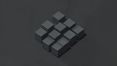 A cluster of small, dark grey metallic cubes arranged on a textured industrial surface