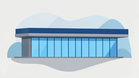A modern commercial retail building with a flat roof and large glass windows