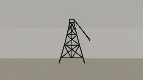 An oil derrick standing in a flat landscape under a hazy sky