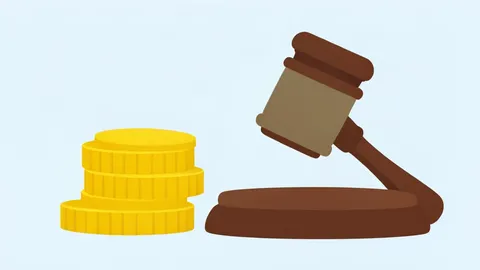 A stack of gold coins next to a wooden gavel