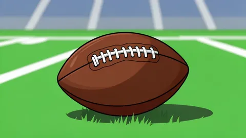 A green football field with white yard lines and a brown leather football resting on the grass