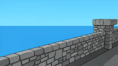 A stone fortress wall overlooking a calm blue sea