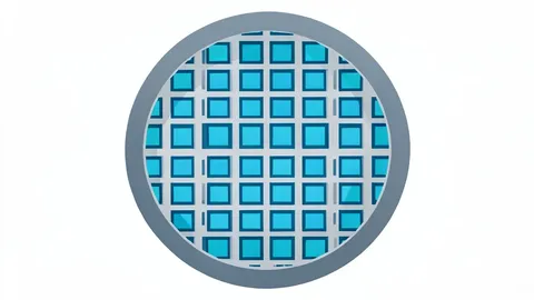 A close-up view of a silicon wafer featuring a precise grid of square integrated circuits