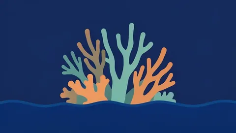 A coral reef structure rising from deep blue ocean water
