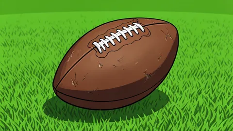 A single football resting on a green grass field