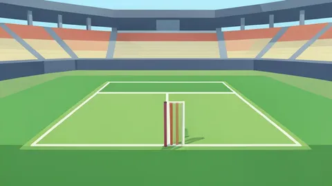 A cricket pitch with a wicket at one end, surrounded by green grass and stadium seating in the background.