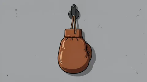 A pair of red boxing gloves resting on a wooden stool
