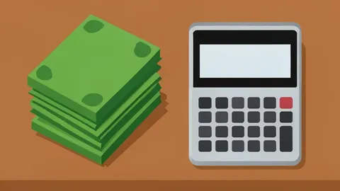 A stack of paper currency and a calculator on a wooden desk