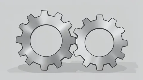 Two large, interlocking gears made of brushed metal, one slightly larger than the other, positioned side-by-side on a neutral surface