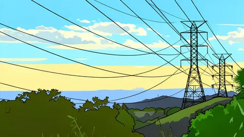 A modern industrial facility with cooling towers situated in a snowy landscape.