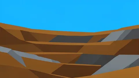A rugged, open-pit mining landscape with exposed layers of earth and rock under a clear sky
