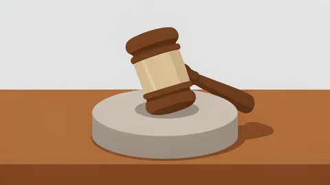 A wooden gavel resting on a polished desk
