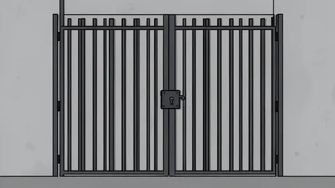 A heavy iron prison gate with vertical bars and a padlock, set against a plain concrete wall.