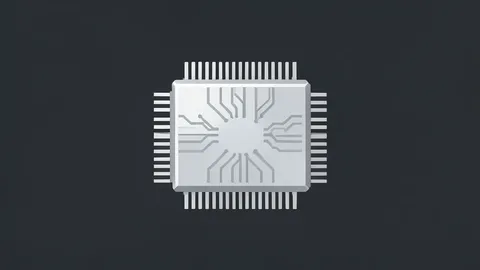 A close-up of a sleek, silver computer processor chip resting on a dark surface