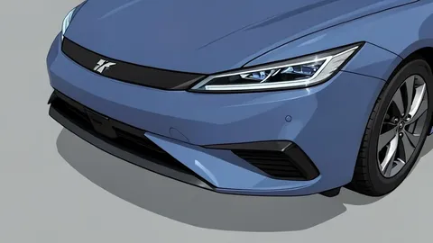 A sleek, modern electric sedan parked on a smooth concrete surface